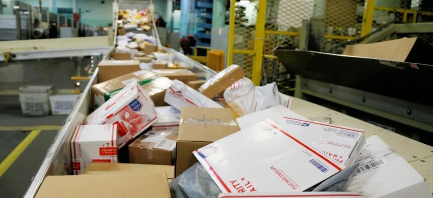 Boxes of mail on a conveyer belt