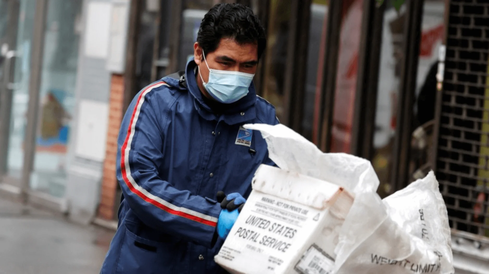Postal worker wearing a mask