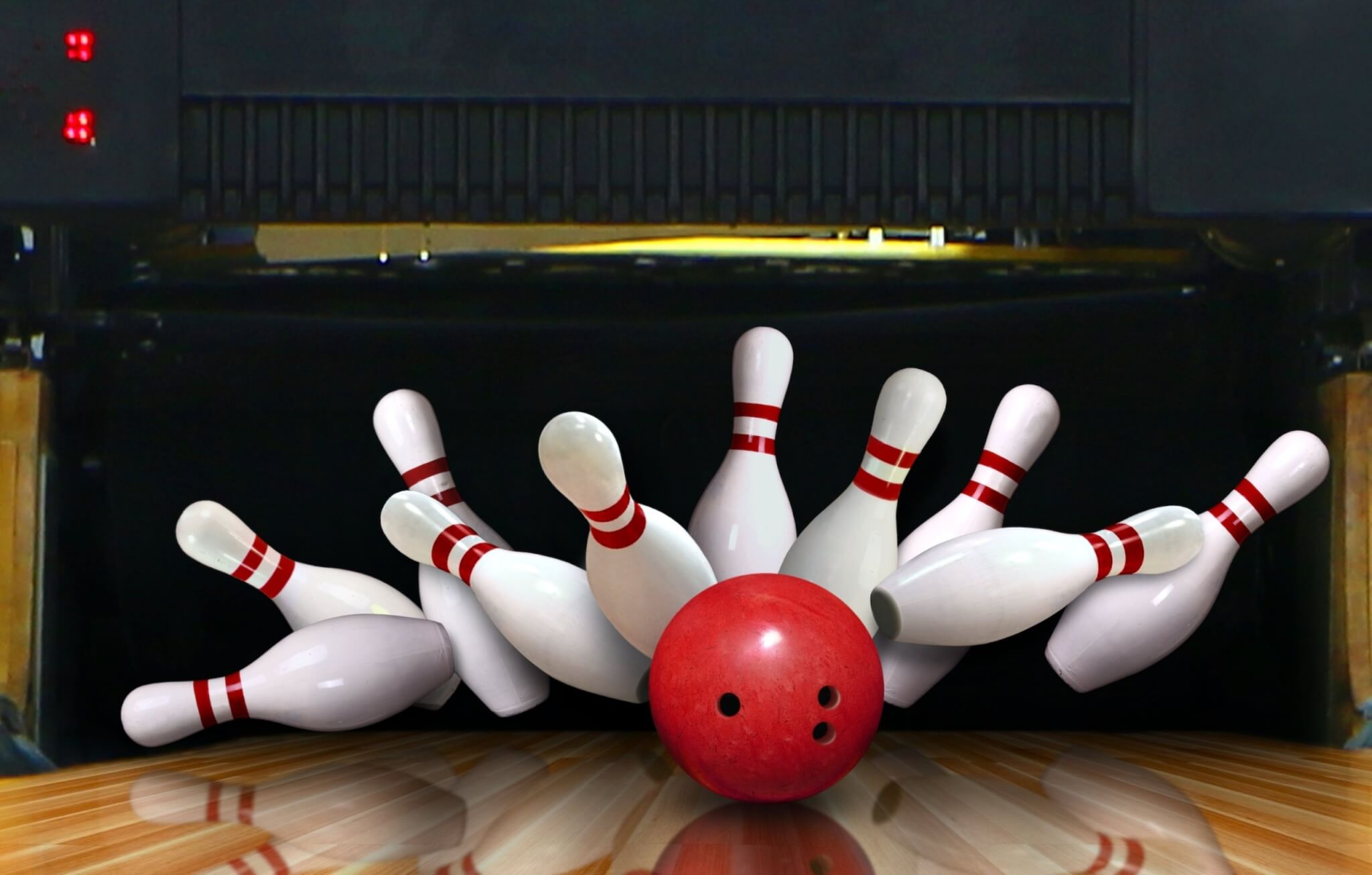 Bowling pins struck by a bowling ball